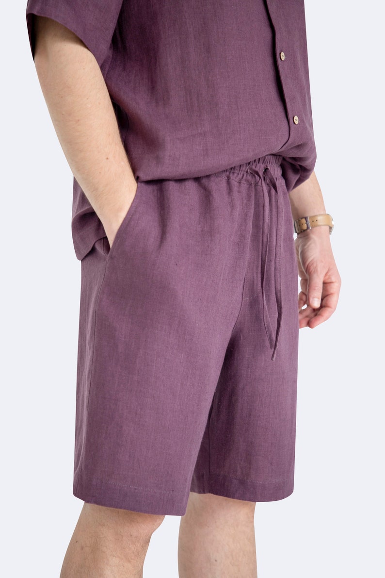 Close-up of drawstring waistband on mens eggplant color linen shorts