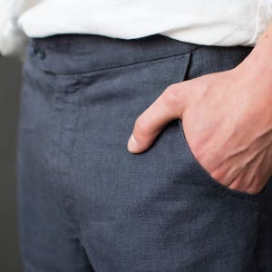 Hand in the side pocket of classic linen pants