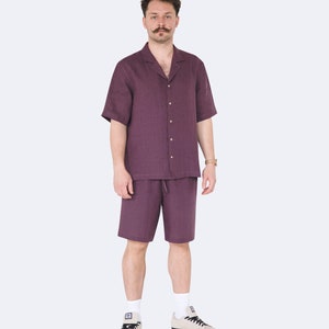 Full front view of model in mens eggplant color linen shirt and shorts set