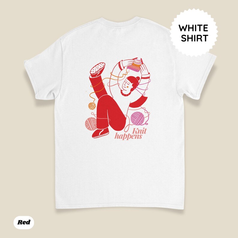 May include: White t-shirt with a red illustration of a person knitting, surrounded by yarn balls. The text "Knit happens" is printed in a pink font. A white circle with the words "WHITE SHIRT" is on the top right.