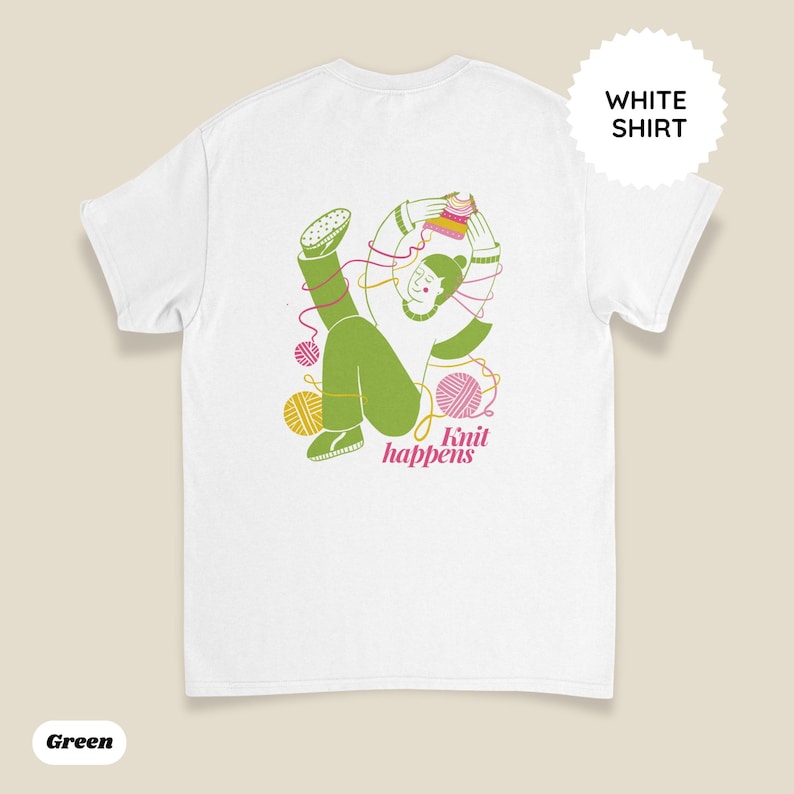 May include: White t-shirt with a green illustration of a person knitting, surrounded by yarn balls. The text "Knit happens" is in pink. A white circle with the words "WHITE SHIRT" is in the upper right corner.
