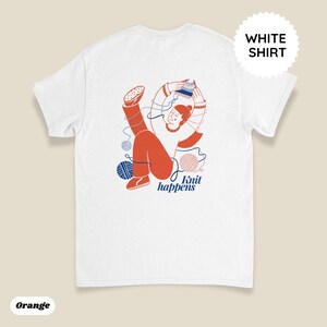 May include: White t-shirt with an orange illustration of a person knitting, surrounded by blue and pink yarn balls. The text "Knit happens" is below the illustration. A white circle with the words "WHITE SHIRT" is in the upper right corner.
