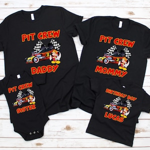 May include: Black t-shirts with a red and yellow cartoon race car and the text "Pit Crew" and "Daddy", "Mommy", "Birthday Boy Lucas" and "Sister".