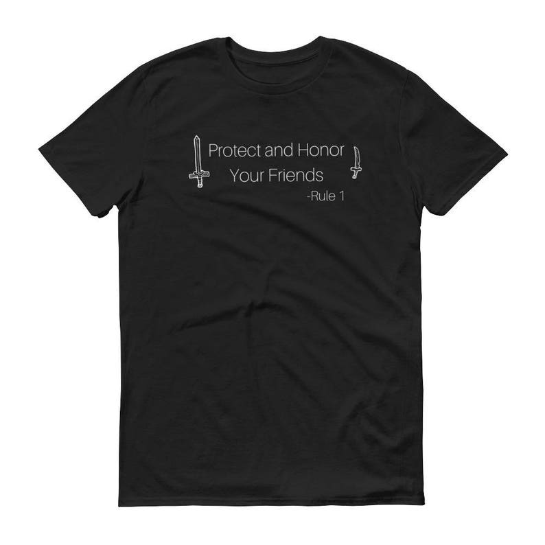 May include: Black t-shirt with the white text "Protect and Honor Your Friends - Rule 1" and two small sword illustrations. The shirt is a short-sleeved crew neck.
