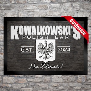 May include: Black and white sign with the text "KOWALKOWSKI'S POLISH BAR EST. 2024 Na Zdrowie!" and a white image of a Polish eagle.