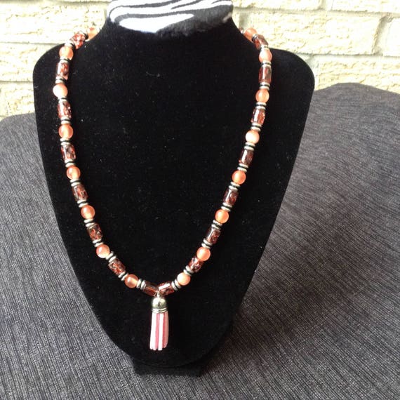 Glass bead necklace with charm