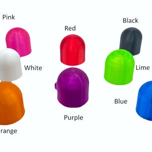 Peut inclure: Assortiment de 10 capuchons en forme de d&ocirc;me de diff&eacute;rentes couleurs, dont rose, blanc, rouge, vert lime, bleu, orange, violet et noir.