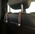Car Headrest Hooks Premium Leather Stainless Steel Hook Hanger Purse Car Seat Head Rest Storage Organizer Handbag Bag Back Seat Car Hook product logo