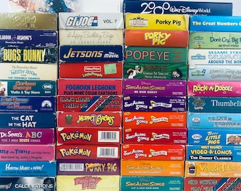 Dibujos animados clásicos, VHS para niños: Los Supersónicos, Pokémon, GI Joe, Porky Pig, Jorge el Curioso, Dr. Seuss, Barrio Sésamo, La Gran Casa Azul del Oso, Muppet TESTED
