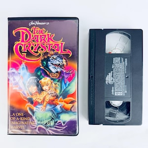 May include: A set of three ceramic mugs with a speckled, matte finish. The mugs are in shades of gray, white, and black. Each mug has a simple, minimalist design, perfect for coffee or tea. The mugs are stacked on top of each other.