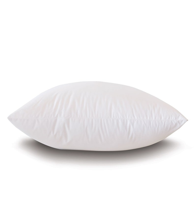 May include: A white pillow with a smooth, soft surface. The pillow is rectangular and has a slight curve to it.