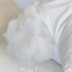 May include: Close-up of a white pillow with a white polyfill stuffing visible through a tear in the fabric. The text "Poly Filling" is printed below the pillow.