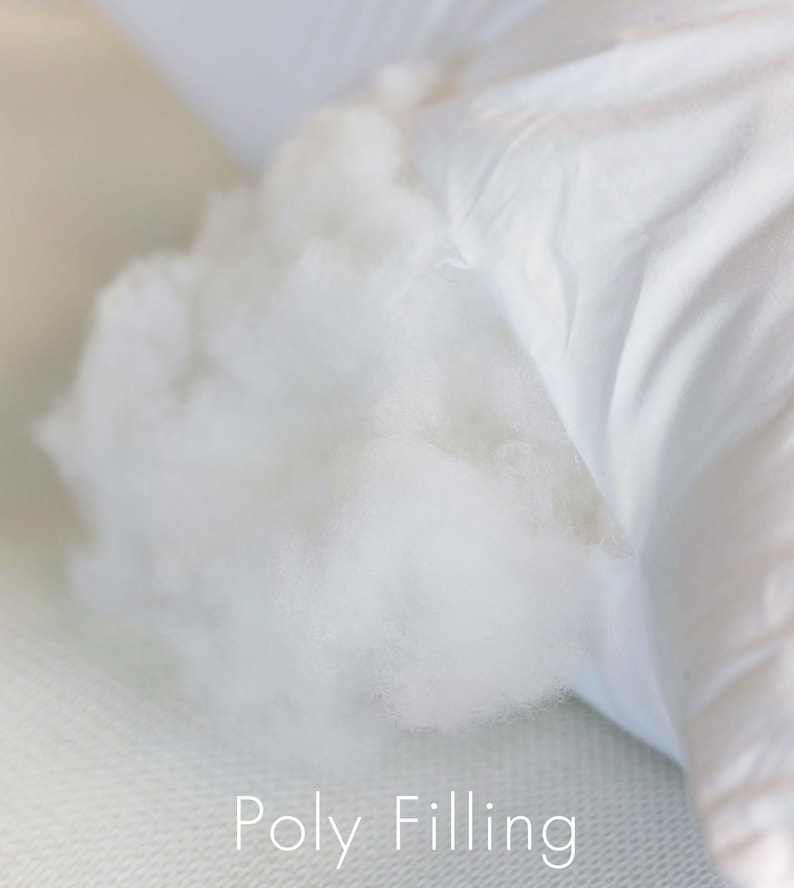 May include: Close-up of a white pillow with a white polyfill stuffing visible through a tear in the fabric. The text "Poly Filling" is printed below the pillow.