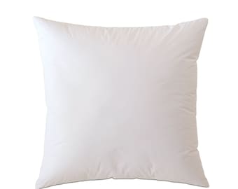 May include: A white square pillow with a smooth, soft surface. The pillow is made of a high-quality material and is perfect for sleeping or lounging.