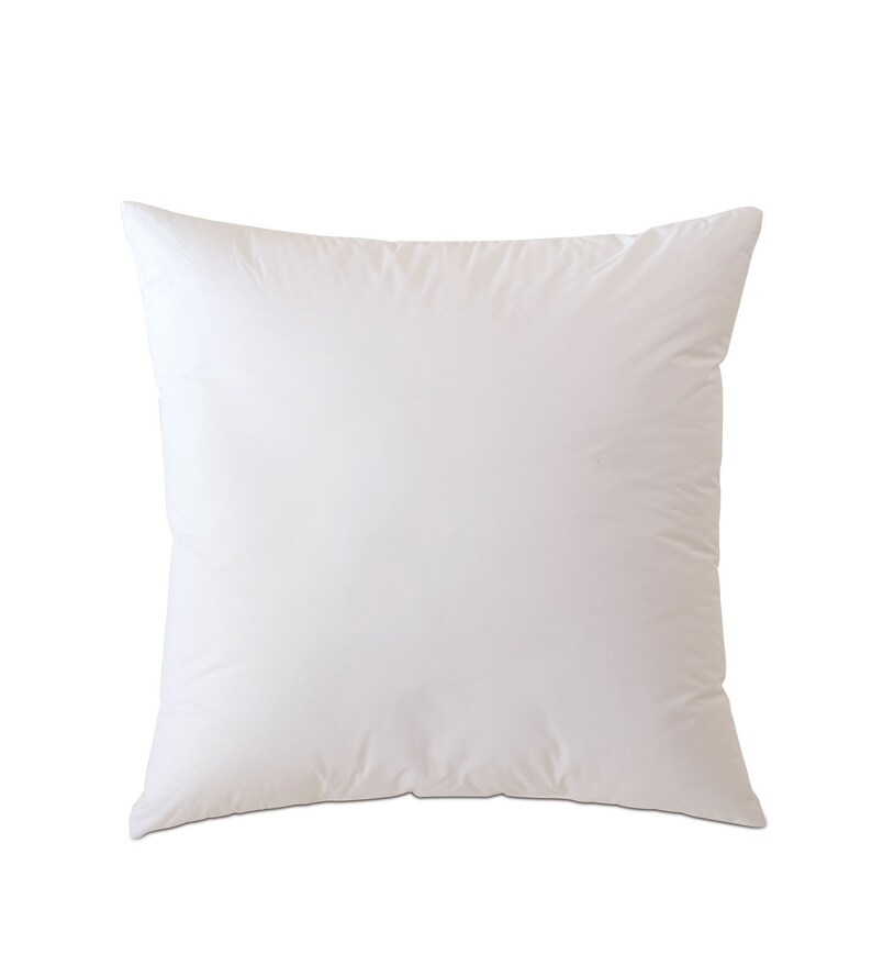 May include: A white square pillow with a smooth, soft surface.