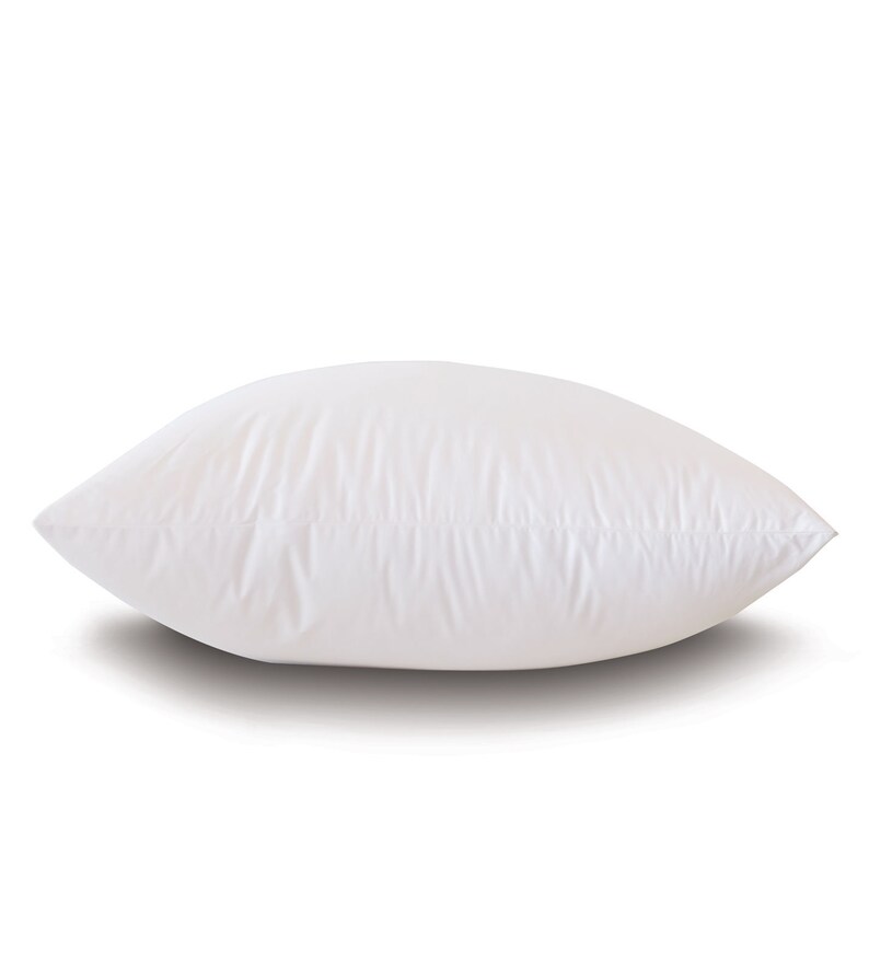 May include: A white pillow with a smooth, soft fabric cover. The pillow is rectangular and has a slight curve to it.