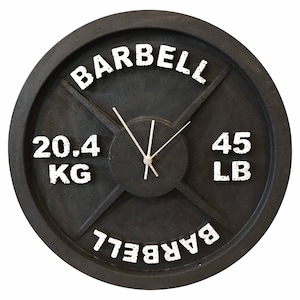 May include: Black weight plate clock with white lettering that reads "BARBELL" and "20.4 KG" and "45 LB".