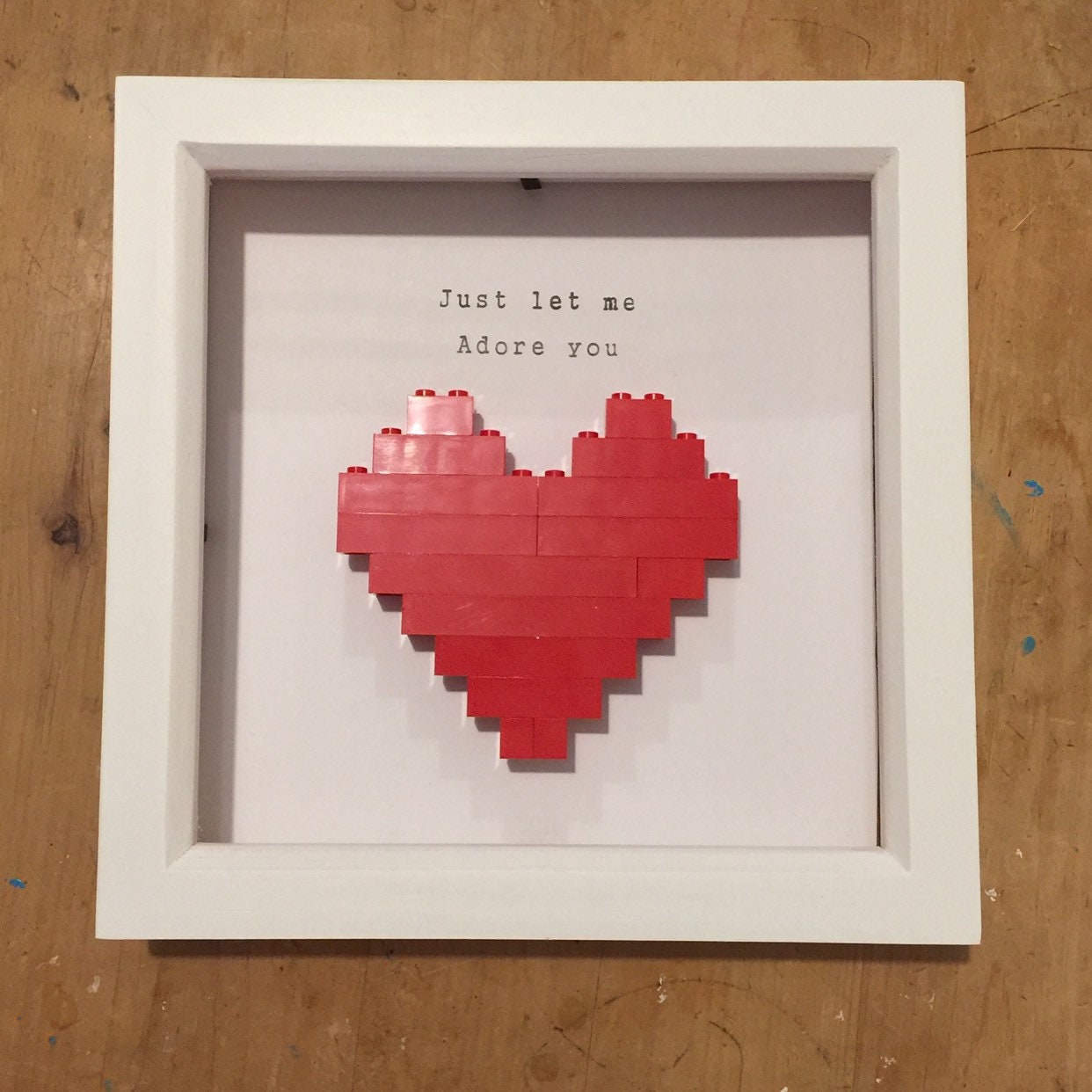 Lego Heart in wooden frame with hand printed quote ‘Just let me adore you’