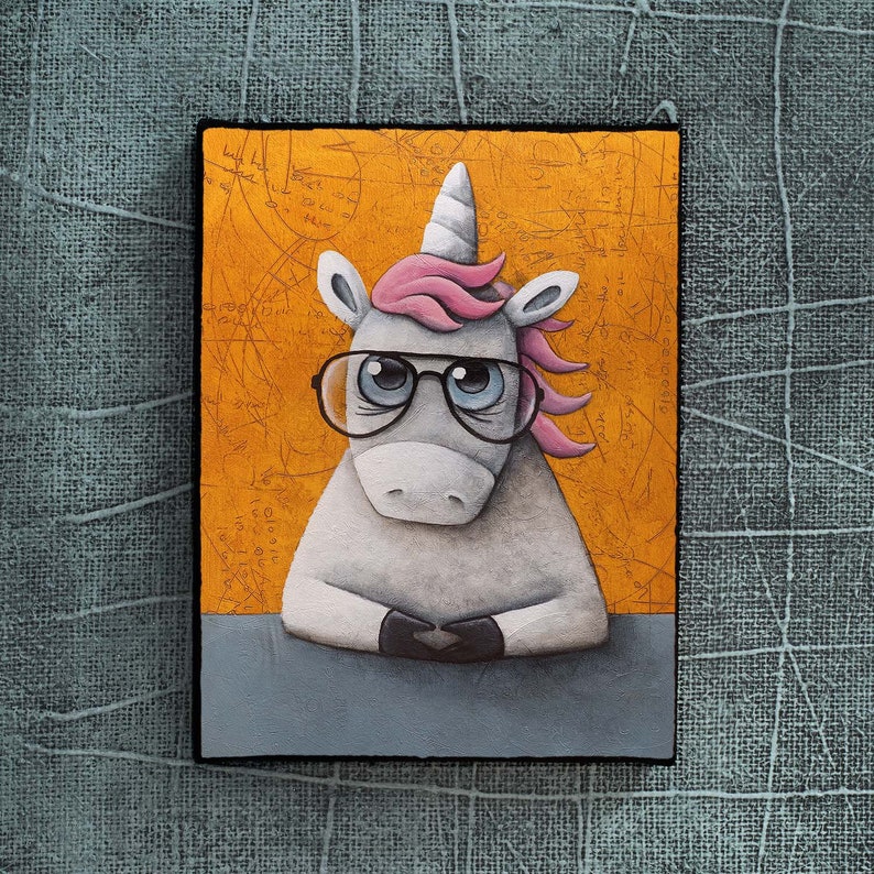 May include: A gray unicorn with a pink mane and horn wearing round, black-rimmed glasses. The unicorn is sitting on a gray surface with a yellow background.