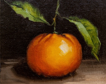 May include: A still life painting of a single orange with green leaves against a dark background. The orange is round and has a smooth, shiny surface. The leaves are long and slender, with a dark green color. The painting is signed "SleeMark -20" in the lower left corner.