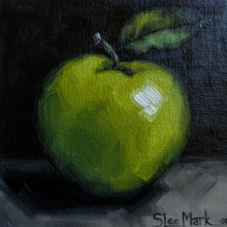 May include: A painting of a green apple on a dark background. The apple is painted in a realistic style with visible brushstrokes. The artist's signature, "Skee Mark", is visible in the lower right corner.