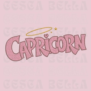 May include: Pink embroidered design featuring the word "CAPRICORN" in a bubble font, with a gold halo, heart, and star accents. The design is set against a light pink background, suitable for apparel or accessories.
