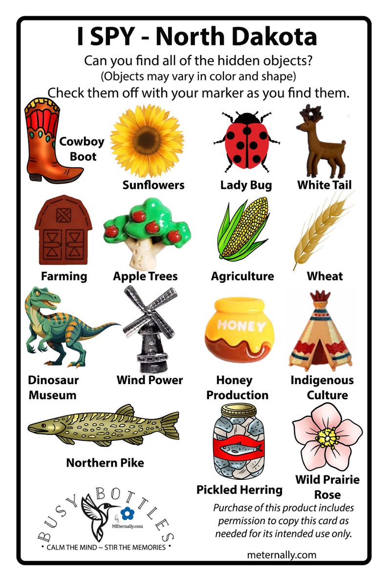 Peut inclure: Une carte de jeu I SPY North Dakota illustrant une botte de cow-boy, un tournesol, une coccinelle, un cerf de Virginie, une grange, un pommier, du ma&iuml;s, du bl&eacute;, un dinosaure, un moulin &agrave; vent, un pot de miel, un tipi, un brochet et une rose.
