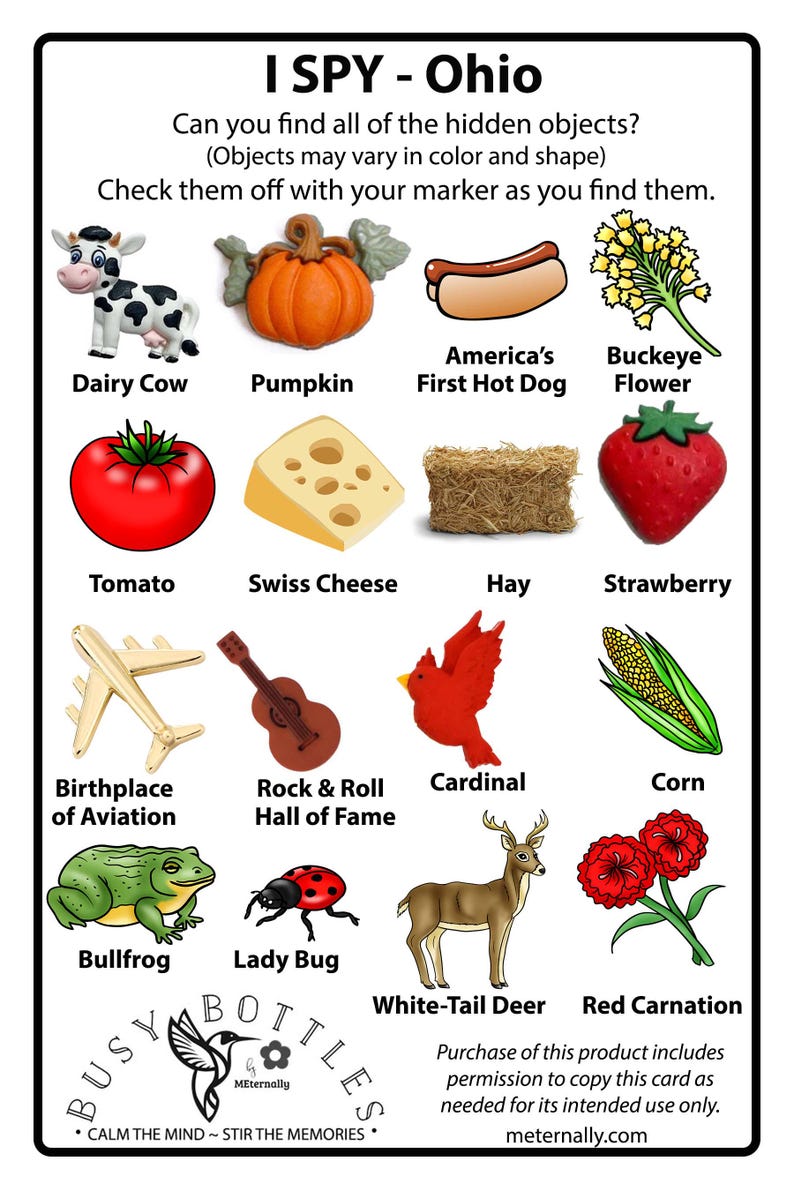 Peut inclure: Une carte de jeu I Spy Ohio pr&eacute;sentant une grille de seize illustrations incluant une vache laiti&egrave;re, une citrouille, un hot-dog, une fleur de marronnier, une tomate, du fromage suisse, du foin, une fraise, un avion, une guitare, un cardinal, du ma&iuml;s, une grenouille, une coccinelle, un cerf et un &oelig;illet rouge.