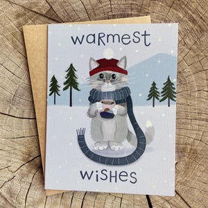 Tarjeta de invierno con un gato acogedor / Los mejores regalos navideños / Vacaciones con gatos calicó / Lindas tarjetas navideñas / Regalos con temática de gatos / Regalos para amantes de los gatos / Regalos para mamás de gatos