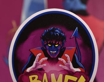 May include: A round sticker with a blue border and a white background. The sticker features a cartoon image of a blue-skinned character with a red cape and a yellow tail. The character is making a gesture with their hands and a pink cloud with the word "BAMF!" in yellow letters is in front of them.