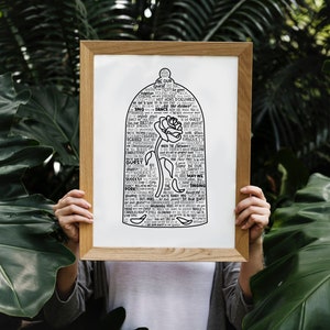 May include: A black and white print of a rose inside a glass dome. The dome is made of words related to the story of Beauty and the Beast. The print is framed in a light wood frame.