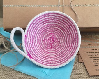 all natural coiled rope bowl with pink thread detail and handle