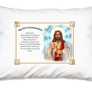 May include: White pillowcase with a gold frame and a picture of Jesus holding a chalice and a wafer. The text inside the frame reads "My First Communion" and includes a prayer to Jesus.