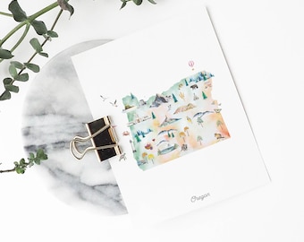 May include: A white rectangular art print featuring a watercolor map of Oregon. The map includes small illustrations of mountains, trees, a bear, a hot air balloon, and coastal elements. The word Oregon is printed in a script font at the bottom.