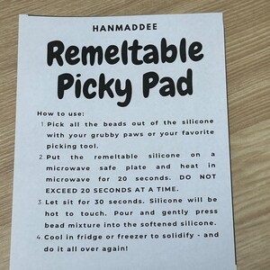 May include: Instructions for using a remeltable silicone picky pad. The instructions include steps for removing beads, heating the pad in the microwave, and cooling the pad in the fridge or freezer.