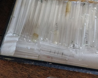 Old box full of 6 different types of test tubes