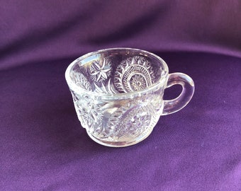 Clear glass punch cups in the pinwheel and stars pattern by Smith