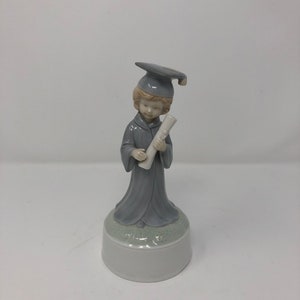 Vintage porcelain graduation themed music box / player