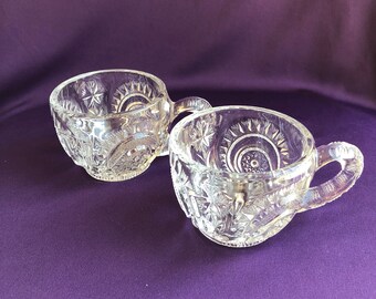 Clear glass punch cups in the pinwheel and stars pattern by Smith