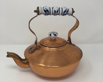 Vintage copper tea kettle with patina