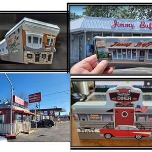 May include: A collection of four images showing different diner-themed decorations. The first image shows a miniature model of a diner with a red and white awning and a sign that says "Where We Make Hamburgers". The second image shows a hand holding a miniature model of a diner with a sign that says "Jimmy Buff's". The third image shows a miniature model of a diner with a sign that says "The Diner" and a red, white, and blue American flag. The fourth image shows a miniature model of a diner with a sign that says "The Diner" and a red, white, and blue American flag.