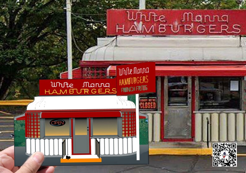 May include: A red and white diner with a sign that reads "White Mana Hamburgers". The diner has a red awning and a large window. There is a smaller version of the diner in the foreground, held by a hand. The smaller diner has a sign that reads "White Mana Hamburgers" and "Open".