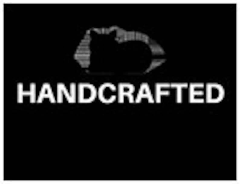 May include: Black and white silhouette of a cat sleeping on a cloud with the word "HANDCRAFTED" in white text below the image.