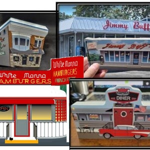 May include: A set of three miniature diner buildings, each with a unique design. The first building is a white building with red accents and the text "White Manna Hamburgers" on the front. The second building is a blue and white building with red accents and the text "Diner" on the front. The third building is a gray building with red accents and the text "Jimmy Buff's" on the front.