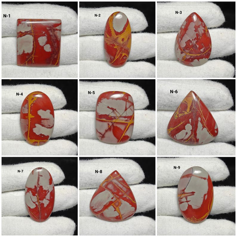 May include: Nine polished gemstones with varied shapes and patterns. The stones display red, grey, and yellow colours. Each stone is labelled N-1 to N-9, highlighting their individual designs and colour combinations.
