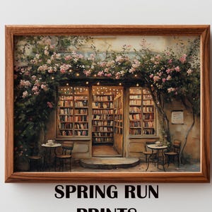 May include: A framed print of a quaint bookstore exterior, adorned with climbing roses and string lights. The shop's windows reveal shelves of books, with small tables and chairs outside. The text "SPRING RUN PRINTS" is at the bottom.