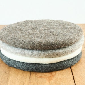Seat cushion made of felted wool, round, 35 cm, natural, undyed, anthracite, white