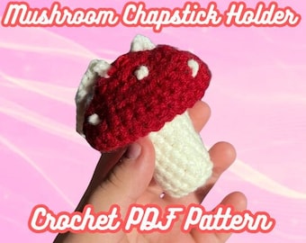 May include: Crochet pattern for a red and white mushroom-shaped chapstick holder. The mushroom has white dots on the red cap and a white stem.