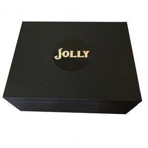 May include: A black box with a gold "JOLLY" logo on the top.