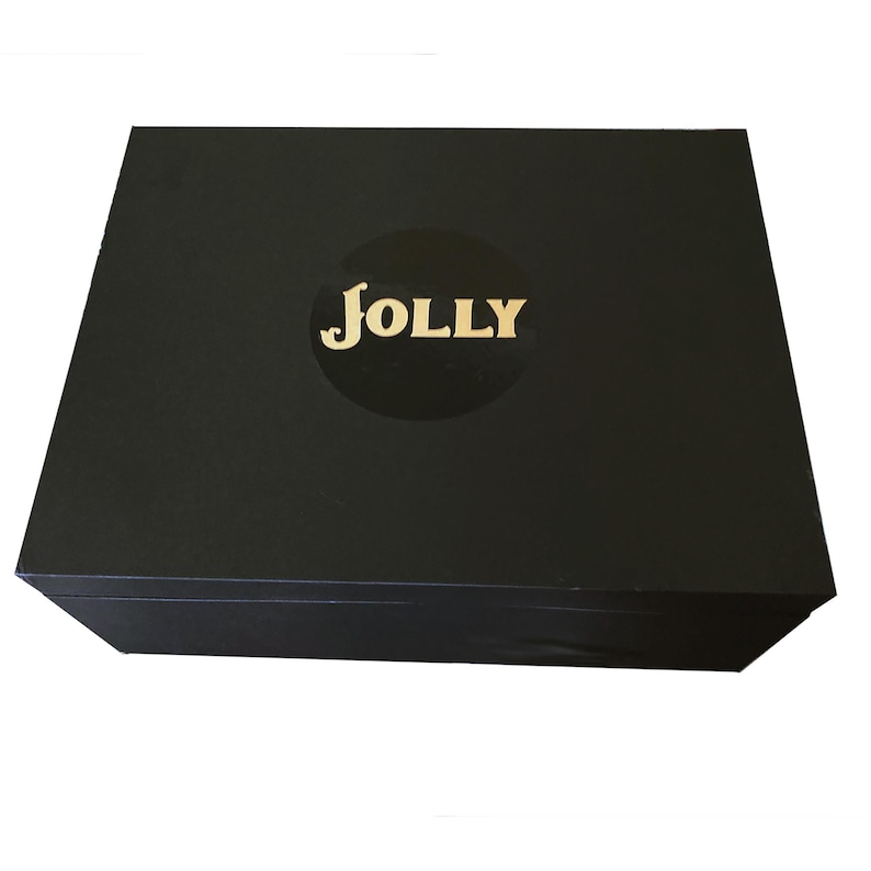 May include: A black box with a gold "JOLLY" logo on the top.